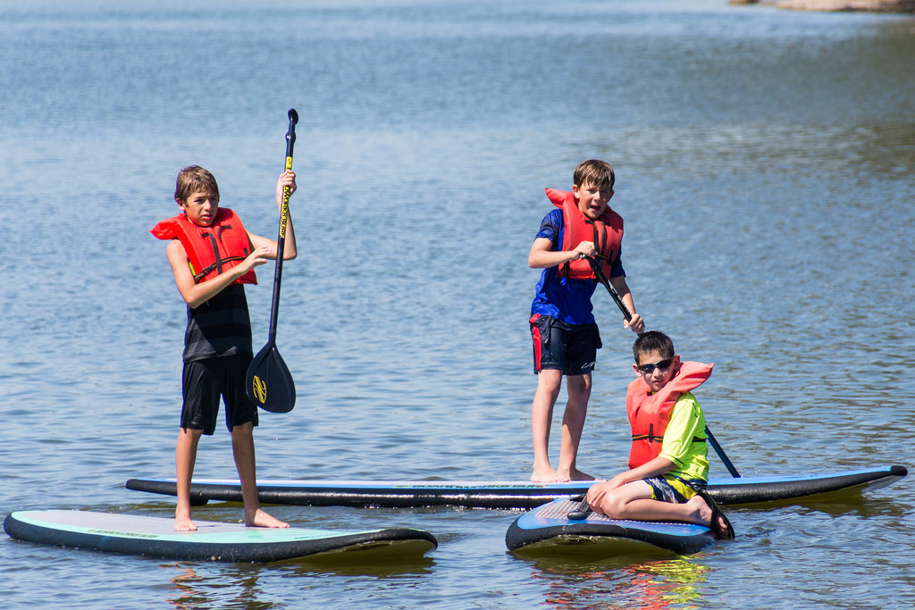 boys doing paddling surf